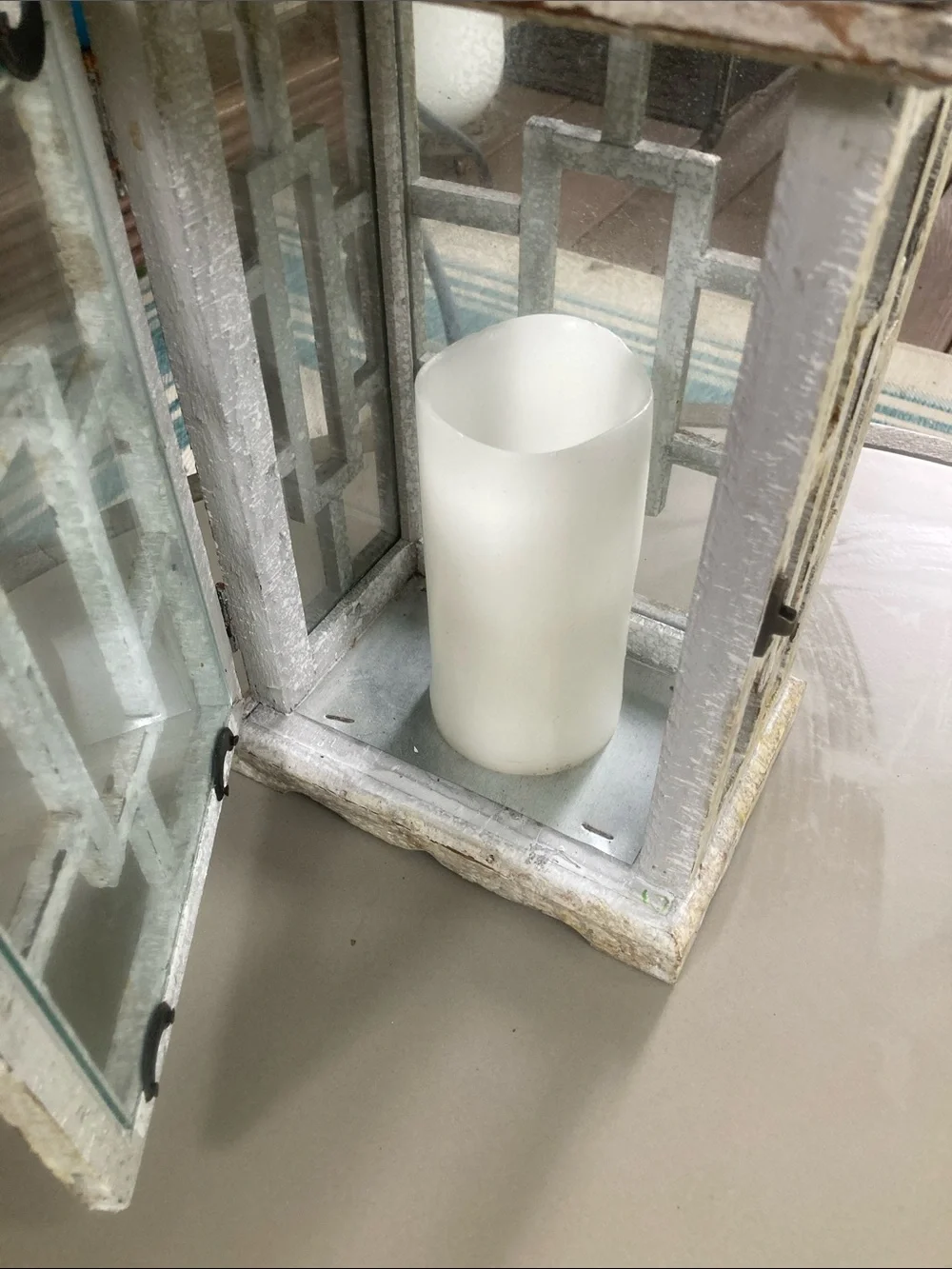Wood and glass paned porch lantern with battery operated wax candle